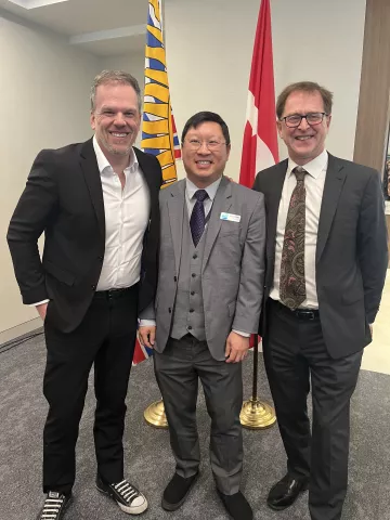 Three men in suits.